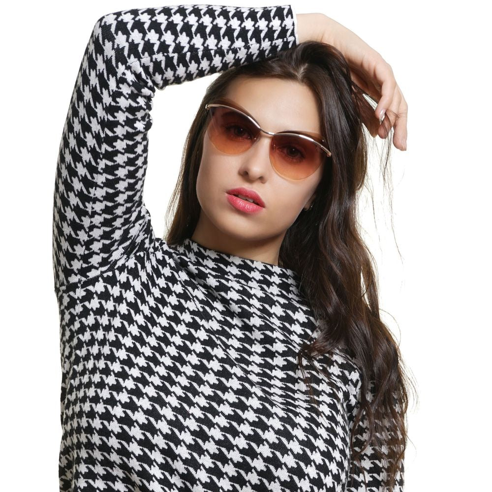 Woman wearing Emilio Pucci Gold Metal & Plastic Sunglasses with cat eye style and rose gradient lenses