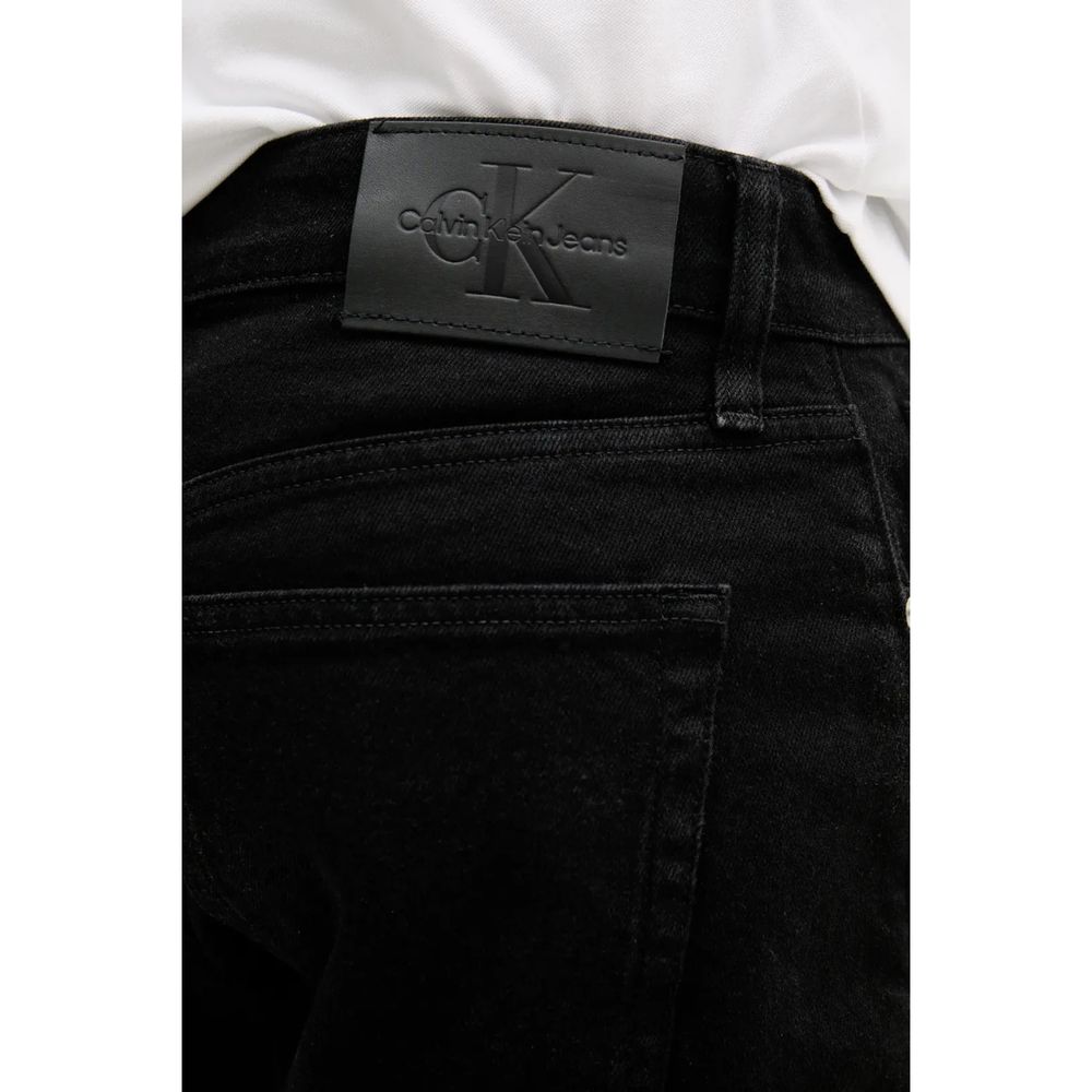 Close-up of Calvin Klein Jeans Black Cotton Bermuda Shorts featuring back pocket and logo patch detail.