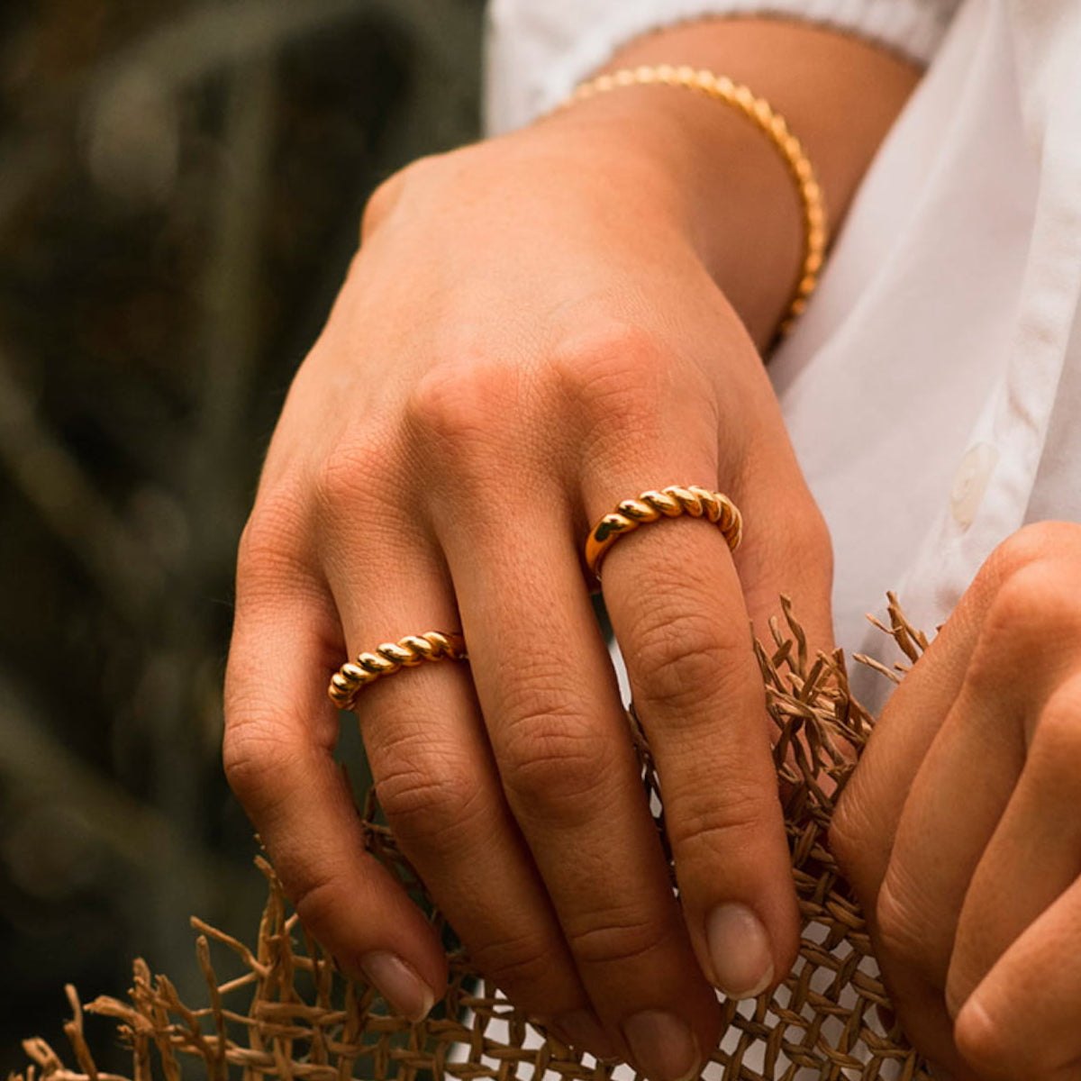 Close-up of hands wearing AN JEWELS JEWELRY Mod. AAC.R05Y-9 rings