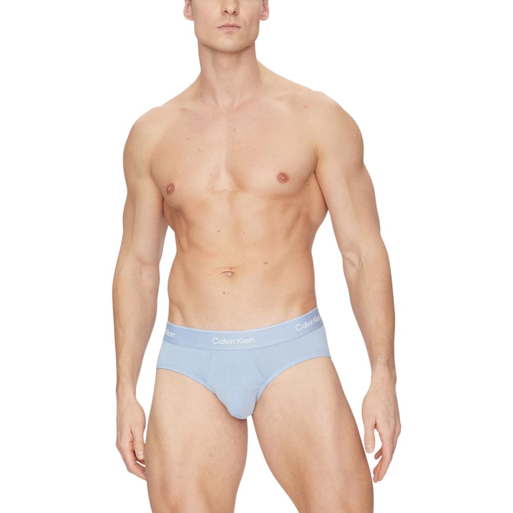 Calvin Klein Underwear Blue Cotton Briefs on model showcasing elastic waistband and comfort fit.