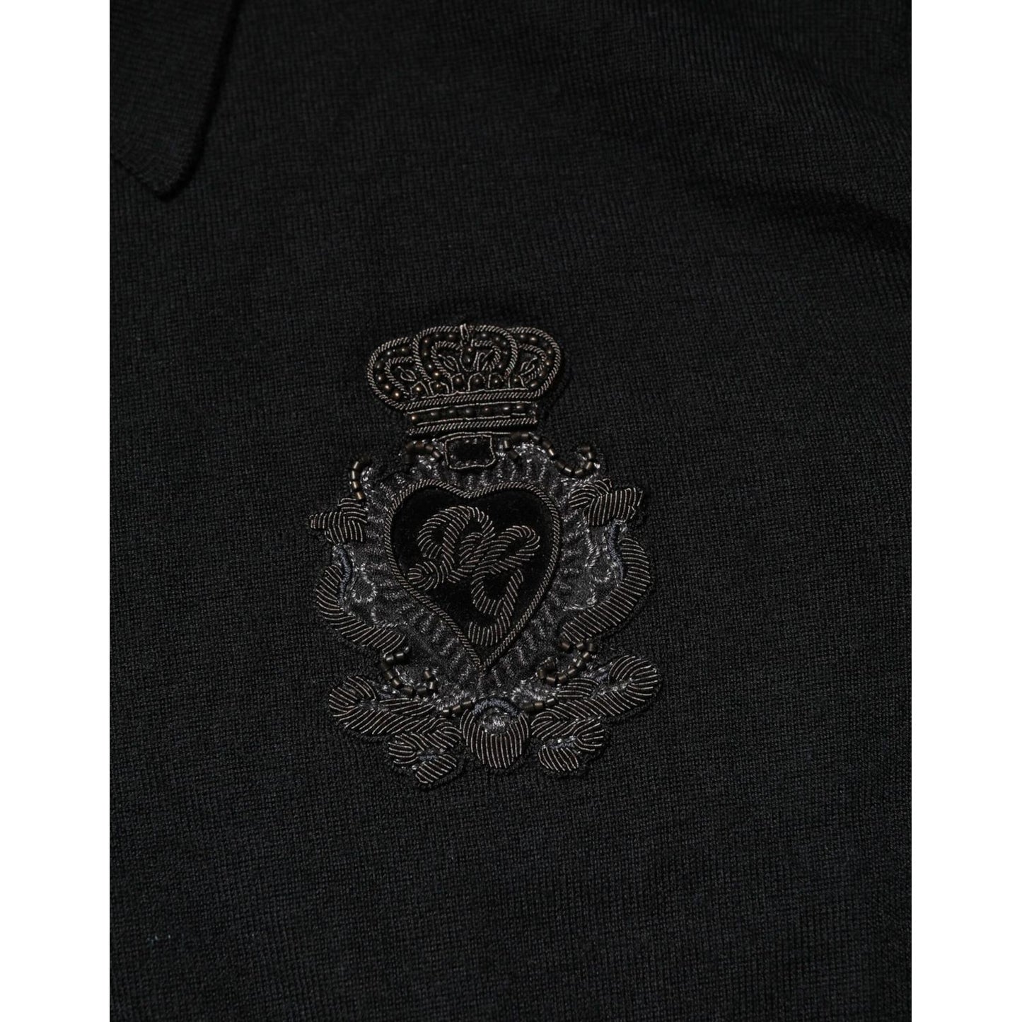 Close-up of the logo patch on the Dolce & Gabbana Black Logo Patch Collared Pullover Sweater.