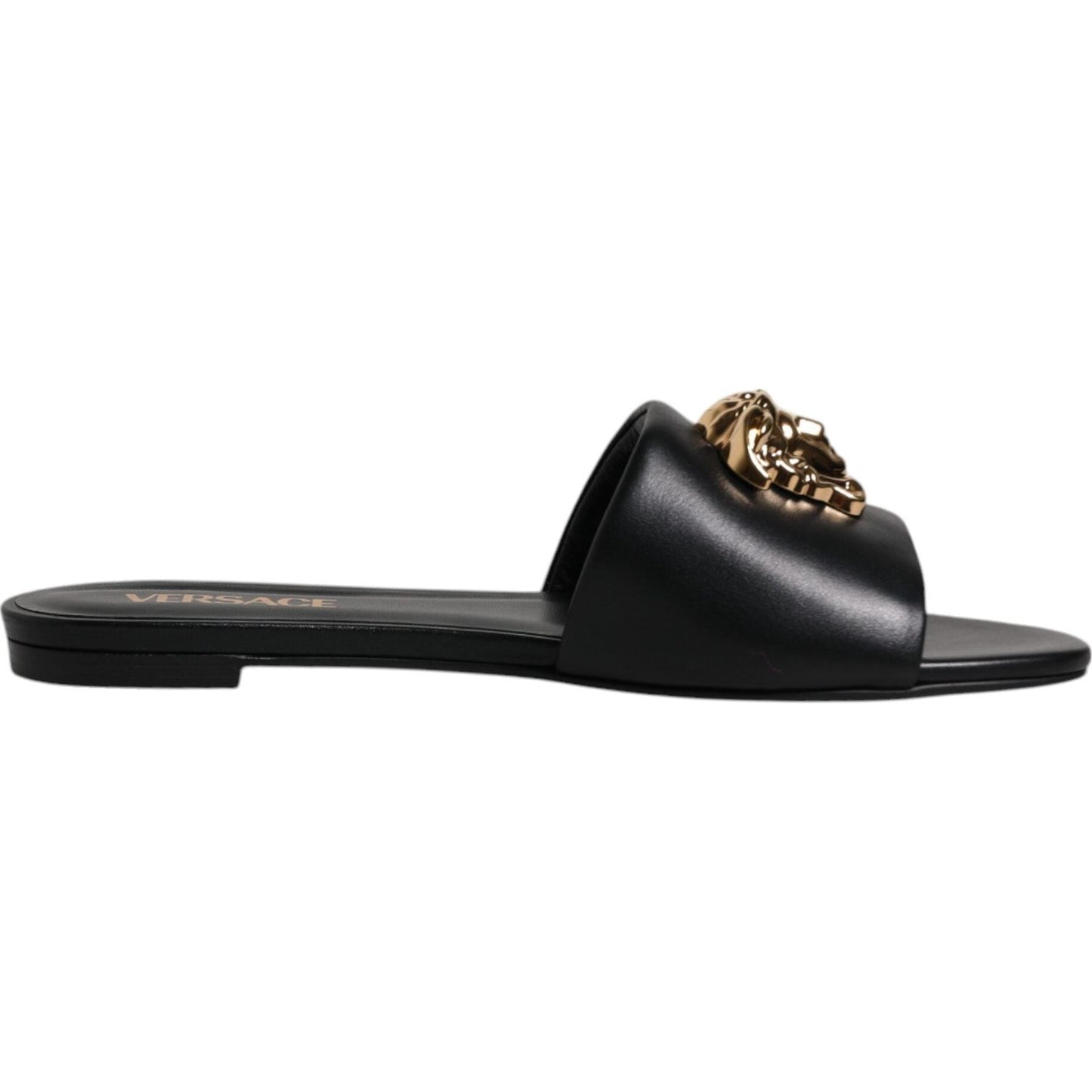 Versace black leather slip-on slides with gold logo plaque, open toe, Italian made, luxury fashion footwear.