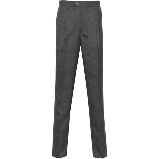 Brunello Cucinelli Trousers Grey in dark grey virgin wool with pleat detailing, belt loops, pockets, and tapered leg design.
