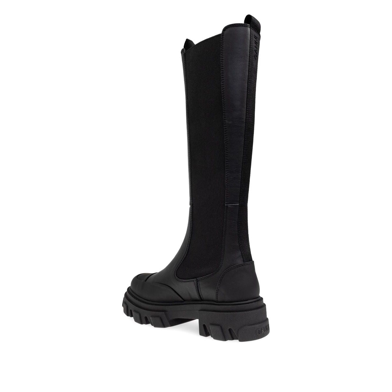 Side view of GANNI Boots Black with faux-leather upper, chunky lug sole, elasticated side panels, and double pull-tab opening.