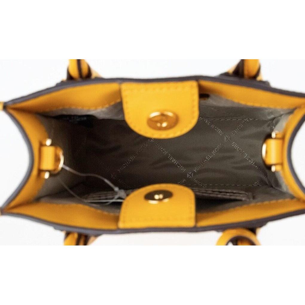 حقيبة تسوق North South من Michael Kors Mercer XS Honeycomb Gold Signature PVC