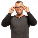 Man wearing Lozza Black Unisex Glasses Frame, showcasing round full-rim design and black color.