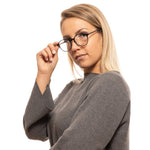 Person wearing Lozza Black Unisex Glasses Frame, stylish full-rim round eyewear in black metal and plastic.