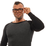 Man wearing Ermenegildo Zegna Black Men Glasses Frame, featuring black plastic full-rim style with spring hinge for comfort.