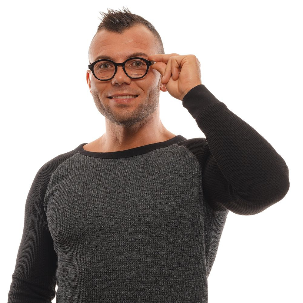 Man wearing Ermenegildo Zegna Black Men Glasses Frame, holding the glasses while smiling.