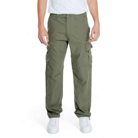 Man wearing Jack Jones Green Cotton Cargo Pants with side flap pockets and tapered fit.