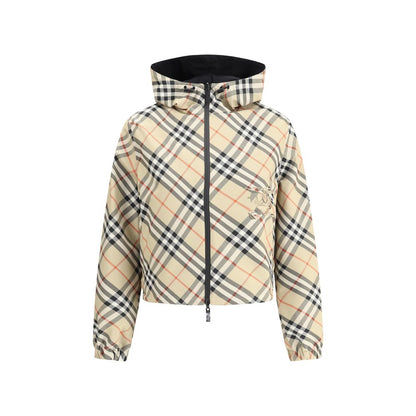 Burberry Brown Polyester Shell Jacket with adjustable hood and reversible Check Archivio pattern. Features elasticized cuffs and zippered pockets.