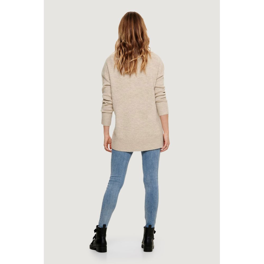 Back view of woman wearing Only Beige Marabou Sweater with jeans, highlighting versatile and trendy fashion style.