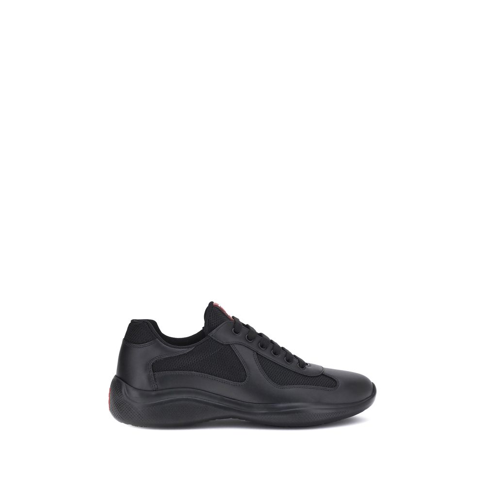 Prada America's Sneakers in black, featuring lace-up closure and textured sole for style and comfort.