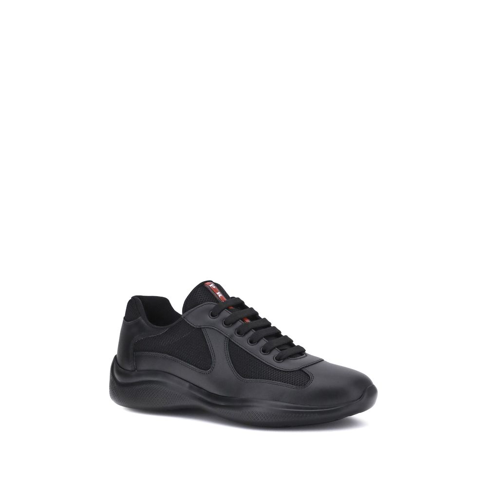 Prada America's Sneakers in black with leather and fabric panels, featuring lace-up closure and textured sole for comfort and style.