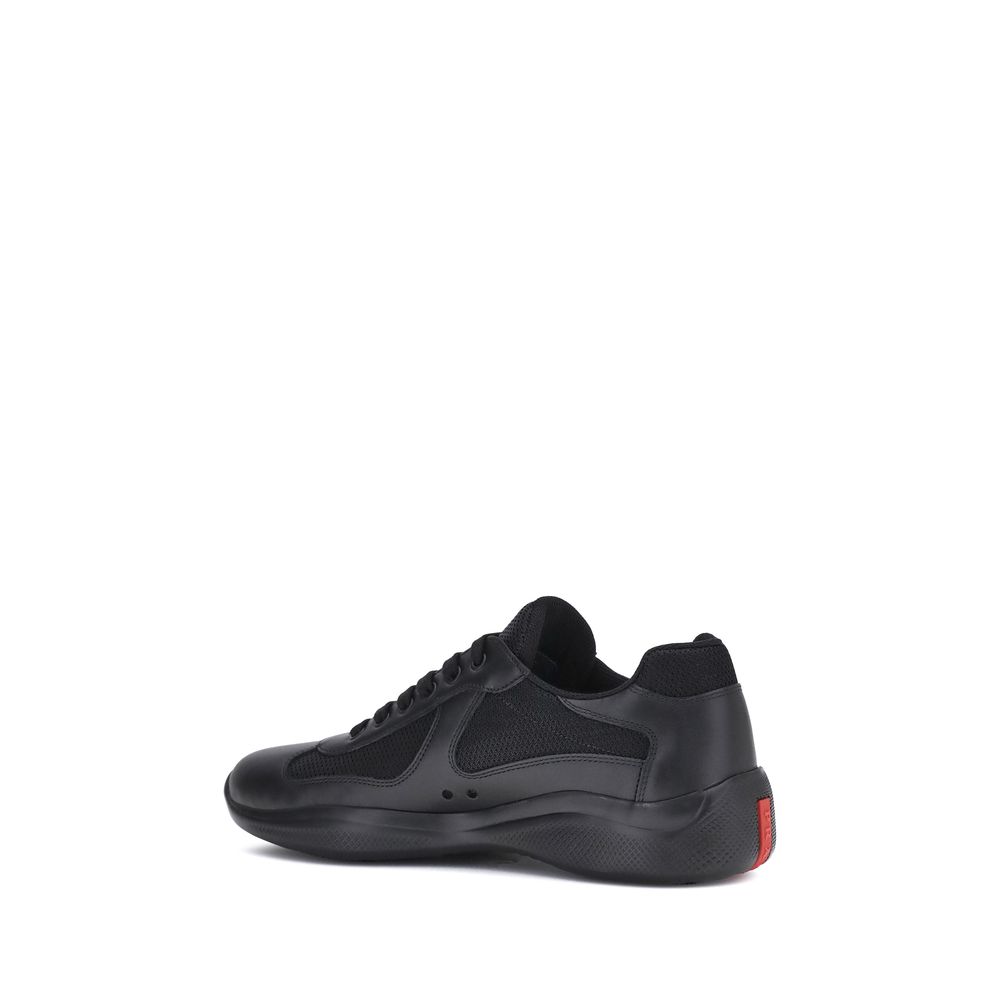 Prada America's Sneakers in black with lace-up closure, leather and fabric panels, and textured sole for comfort and style.