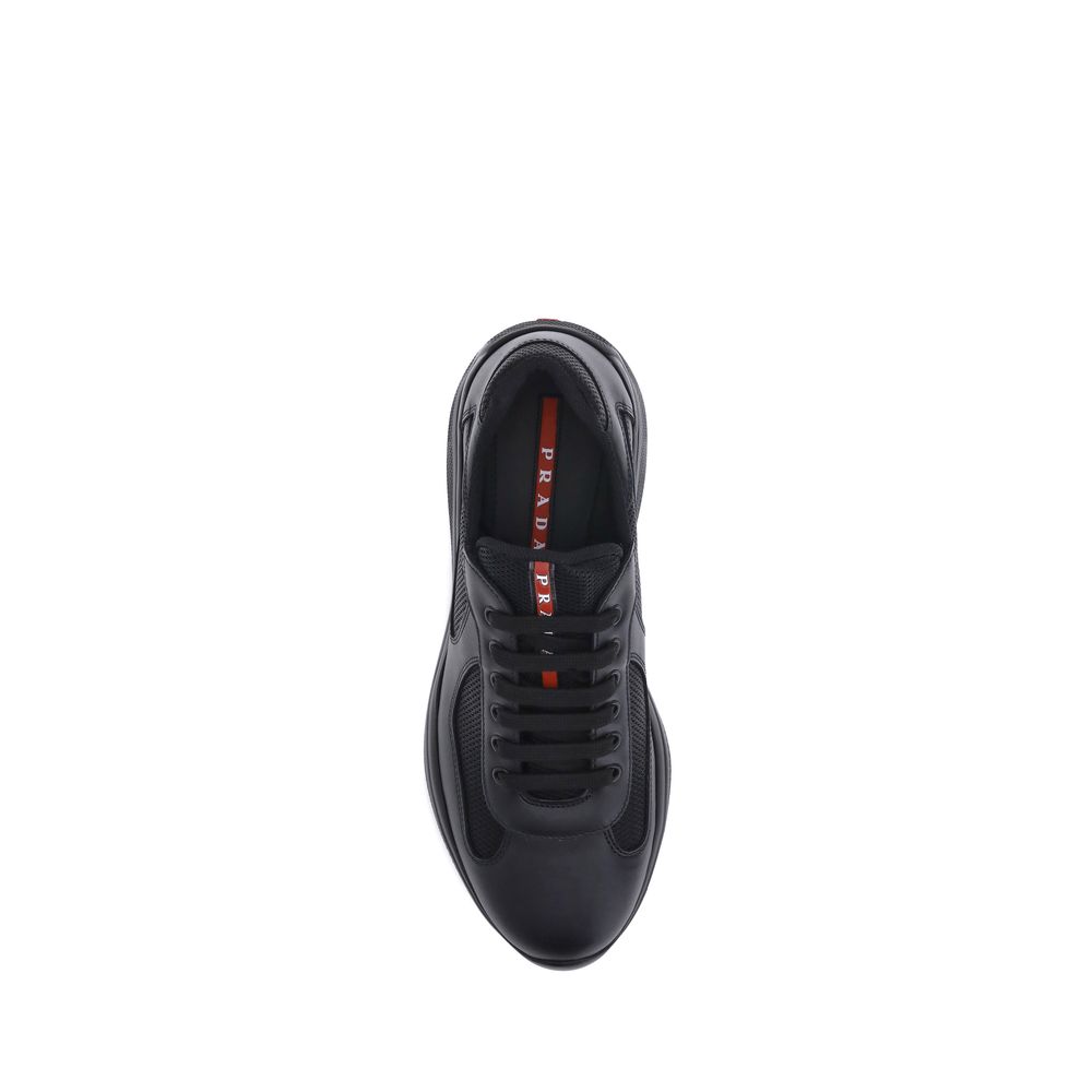 Top view of Prada America's Sneakers in black, featuring lace-up closure and leather-textile design.