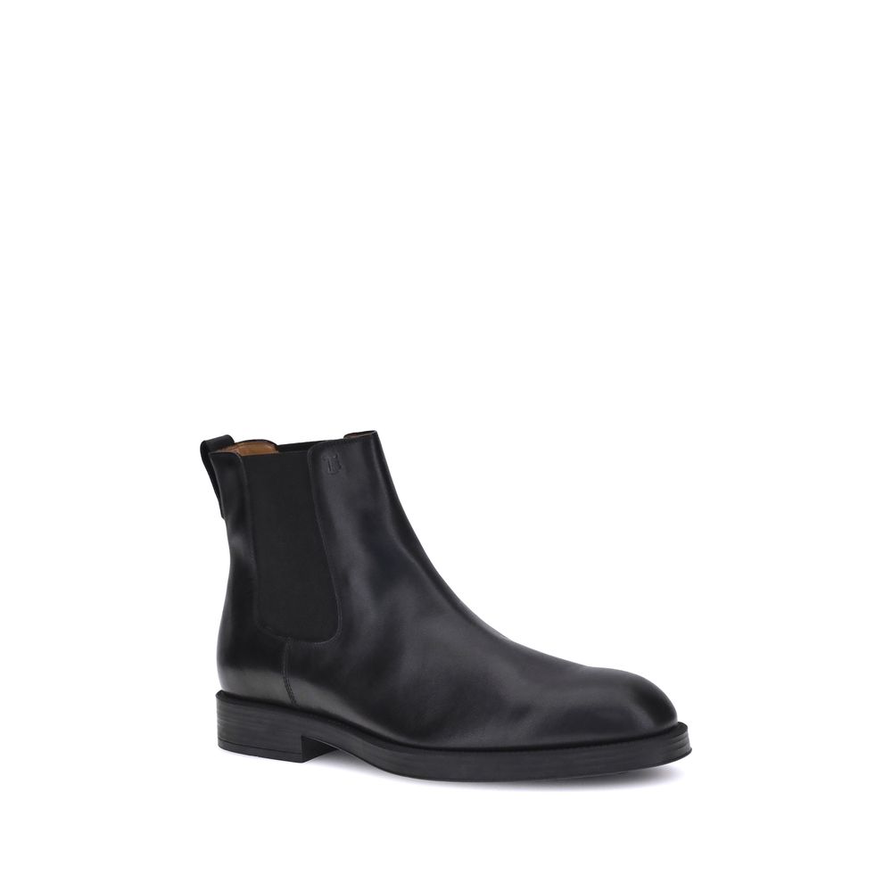 Tod's Black Calf Leather Bos Taurus Chelsea Boots with elastic side inserts and back tab for easy fit.