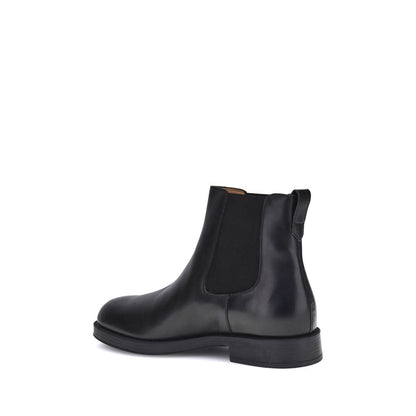 Alt Tag: Side view of Tod's Black Calf Leather Bos Taurus Chelsea Boots with elastic side inserts and back tab.
