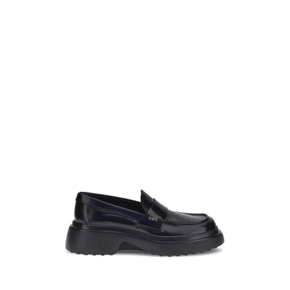 Alt Tag: Tod's Black Rubber Platform Loafers with patent leather upper and distinctive logo plaque, featuring a contemporary rubber sole design.