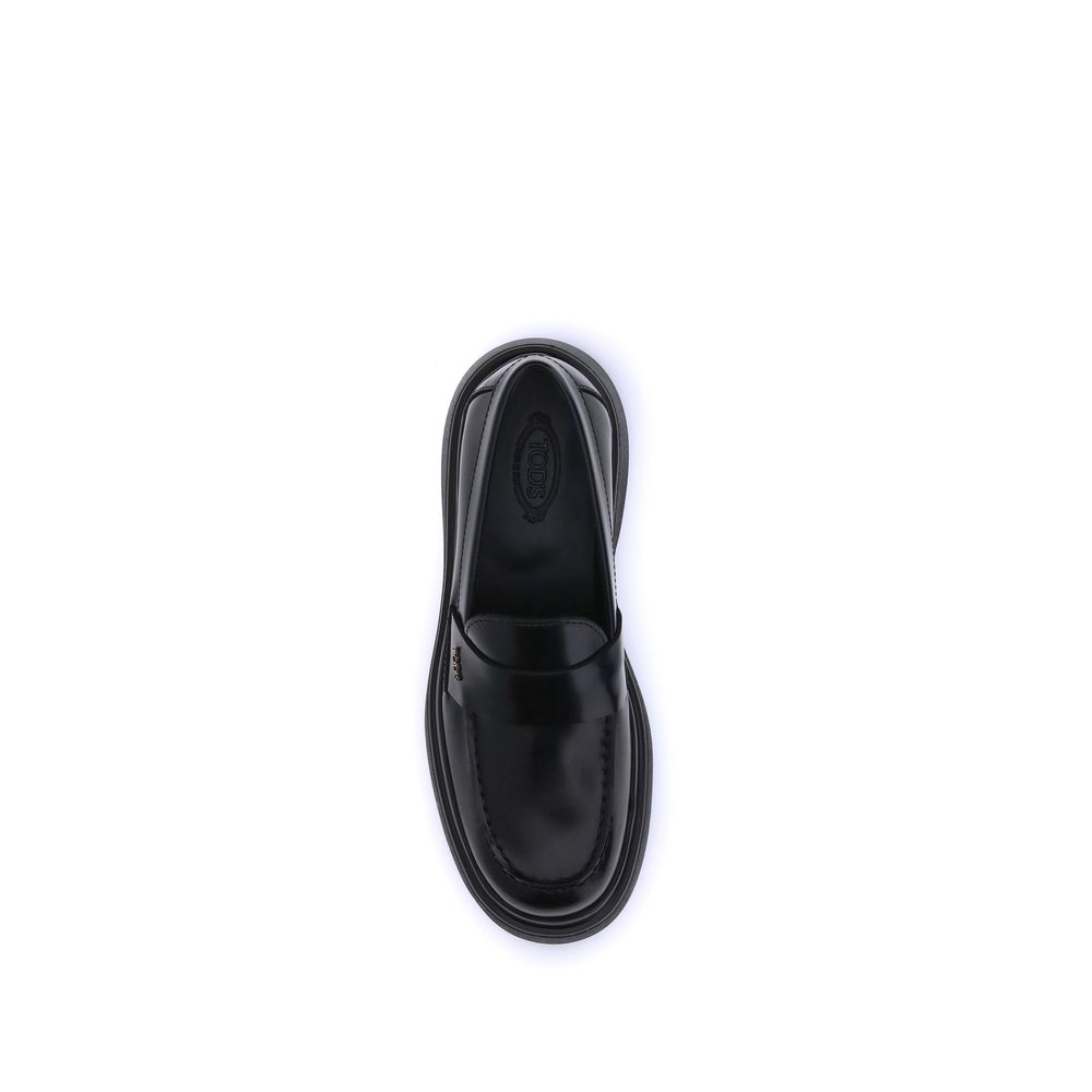 Top view of Tod's Black Rubber Platform Loafers with patent calf leather and distinctive side logo plaque, elegant and contemporary design.