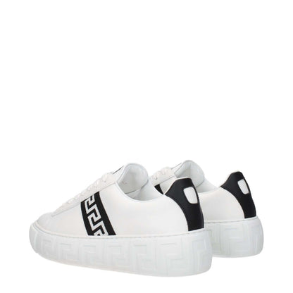 Versace White Leather Low Top Sneakers with black accents, featuring front logo, round toe, lace-up closure, and rubber sole. Casual style.
