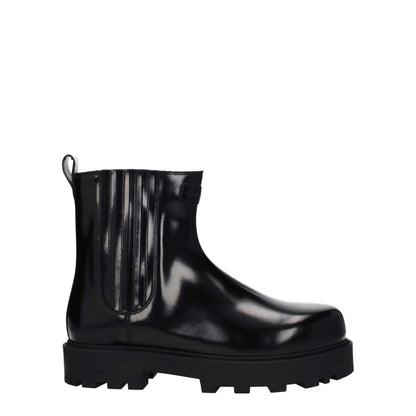 Givenchy Black Leather Ankle Boots with front and back logo, rubber sole, and 4 cm mid heel, featuring a round toe design for casual style.