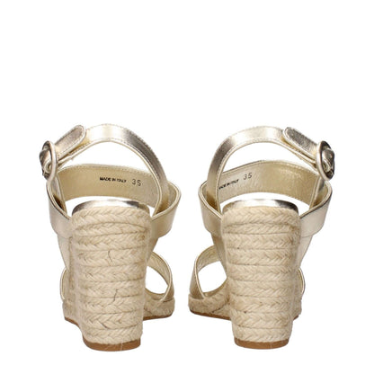 Prada Gold Leather Wedge Sandals with vintage effect and woven heels showcasing Italian craftsmanship.