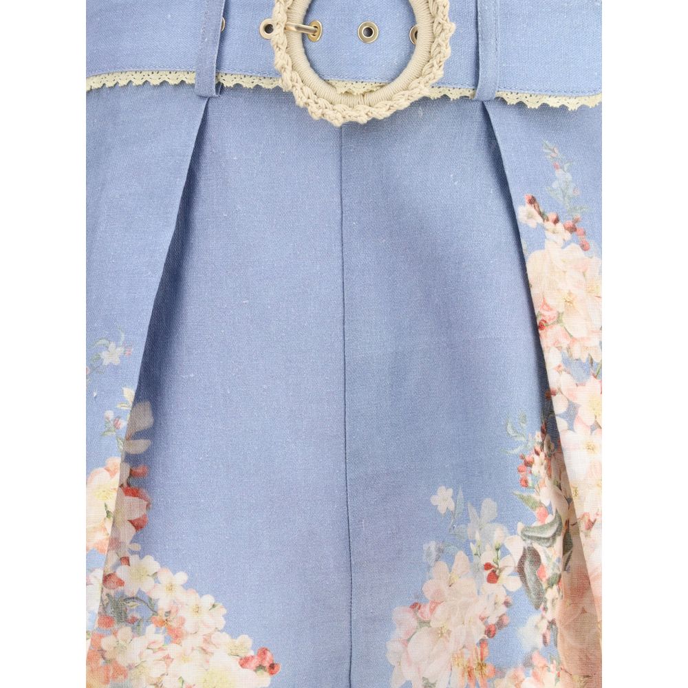 Zimmermann Light Blue Linen Bermuda Shorts featuring botanical print, belted waist, and pleats for a chic summer look.