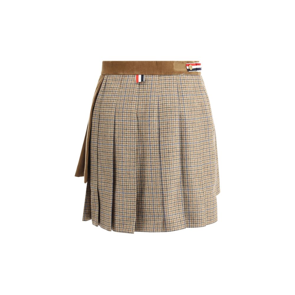 Thom Browne Brown Wool Mini Skirt with pleats, velvet and houndstooth layers, iconic striped band, and adjustable button closure.