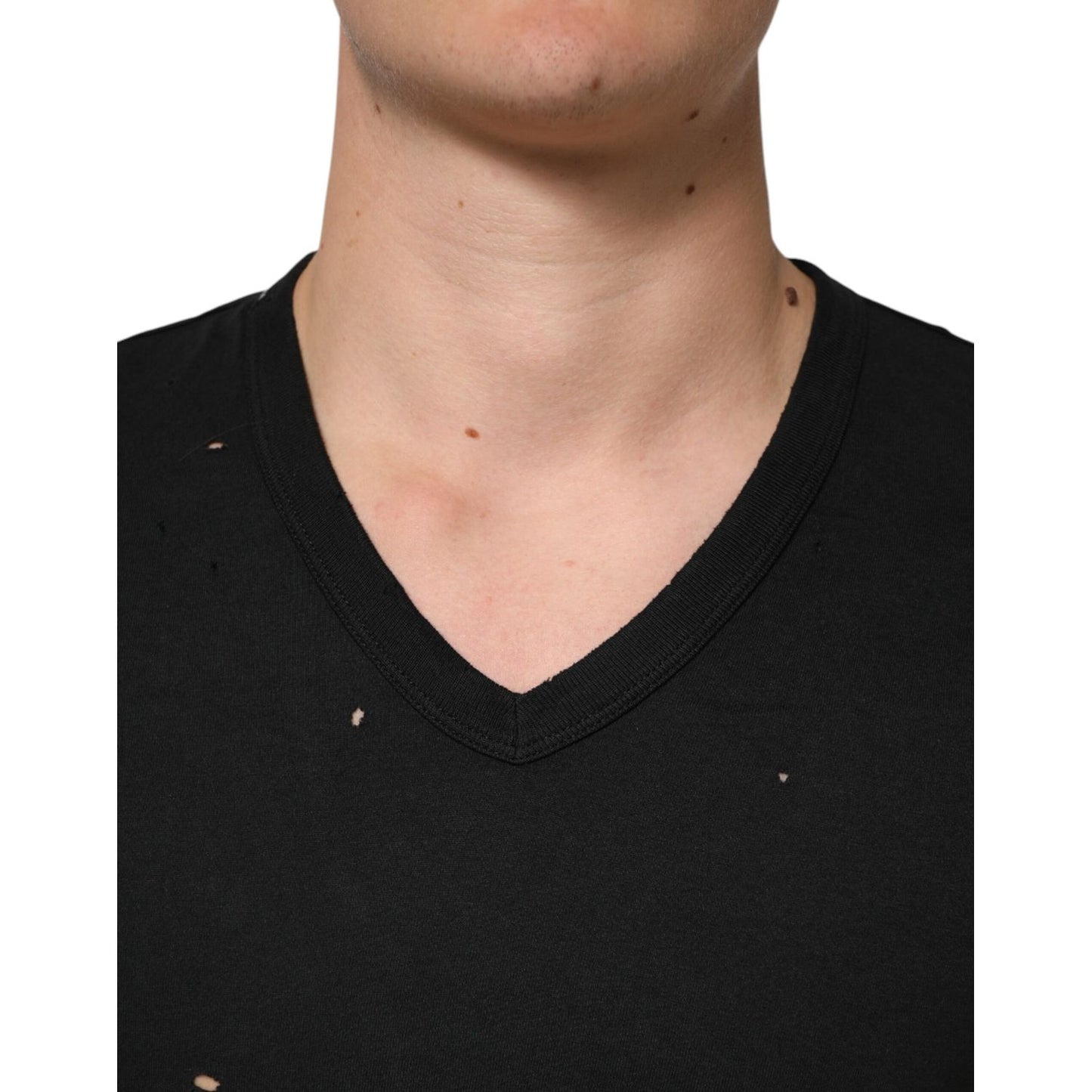 Dolce & Gabbana Black Cotton Tattered Logo V-Neck Men T-shirt with punched-hole design and sleek neckline close-up view.