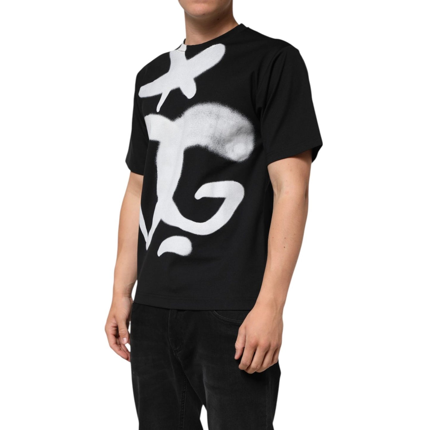 Dolce & Gabbana Black Cotton DG Logo Graffiti Short Sleeve T-shirt with oversized white graffiti-style logo on a model.