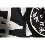 Close-up of Dolce & Gabbana Black White Cotton Oversized Graffiti T-shirt showing graffiti print and neckline details.