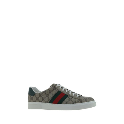 Gucci Beige Rubber Low Top Sneakers with GG jacquard, lace-up closure, platform sole, leather logo detail, and side oblique bands.