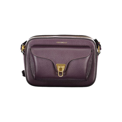 Coccinelle Purple Leather Women Handbag with adjustable strap, twist closure, external and internal pockets, Italian craftsmanship.