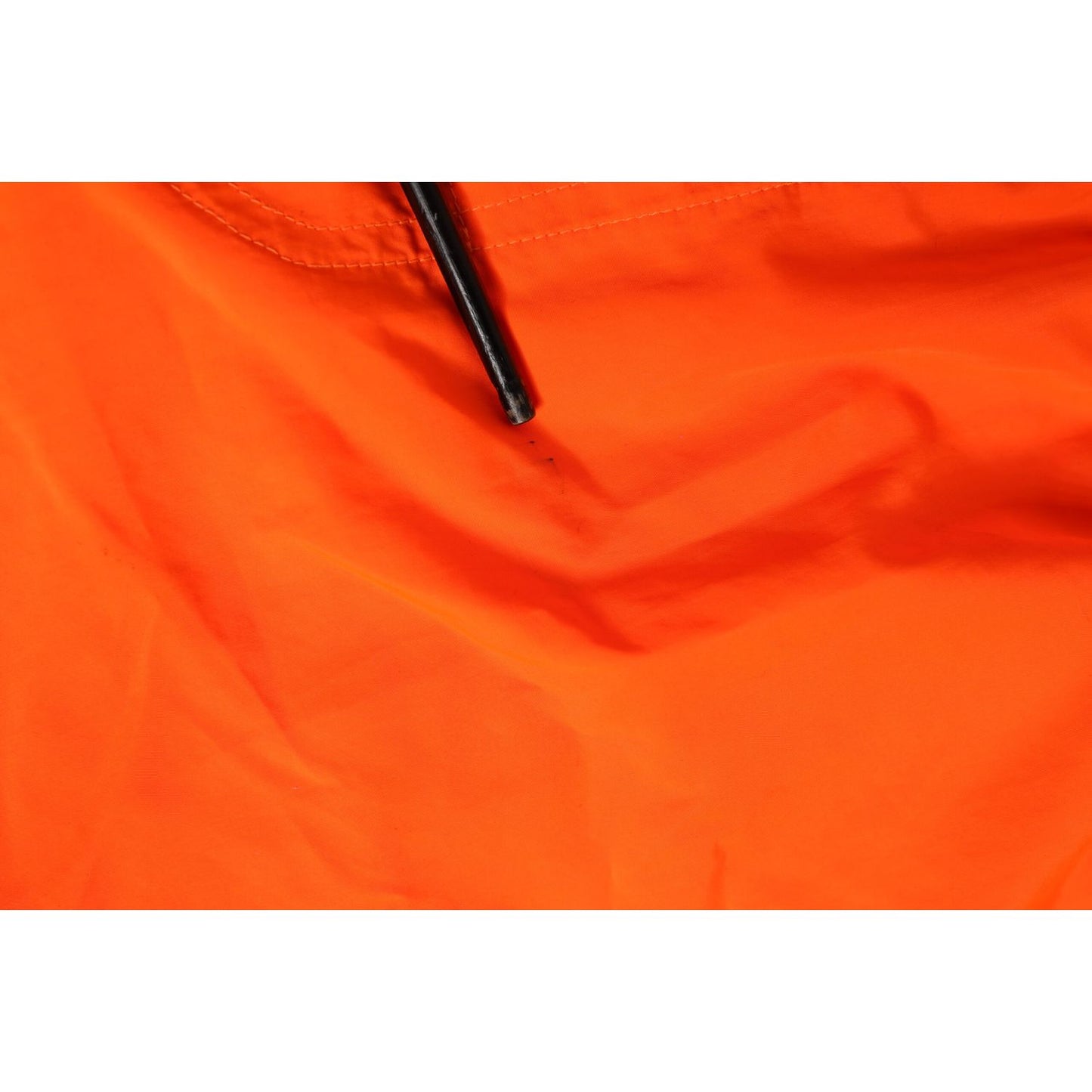 Close-up of Dolce & Gabbana Orange Polyester Beachwear Men Shorts Swimwear with zipper detail.
