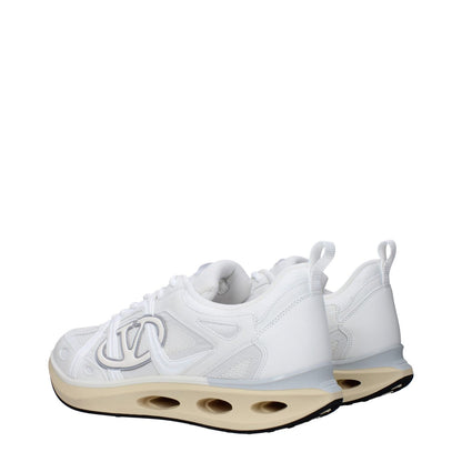 Valentino Garavani White Fabric Athletic Sneakers featuring side logo, lace-up closure, and rubber sole with low flat heel.