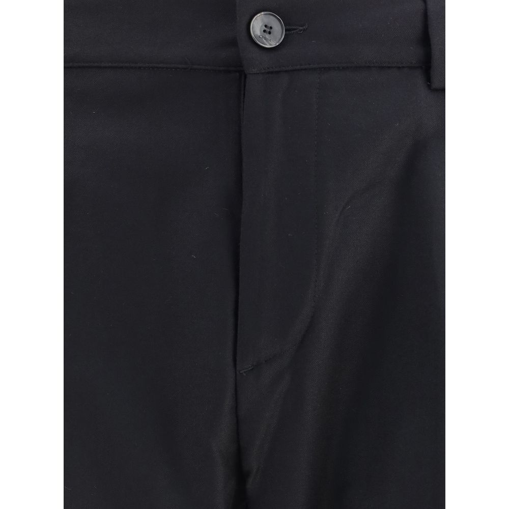 Close-up of Cruna Black Fleece Wool Dress Pants with buttoned waist and elegant style, perfect for casual yet polished look.