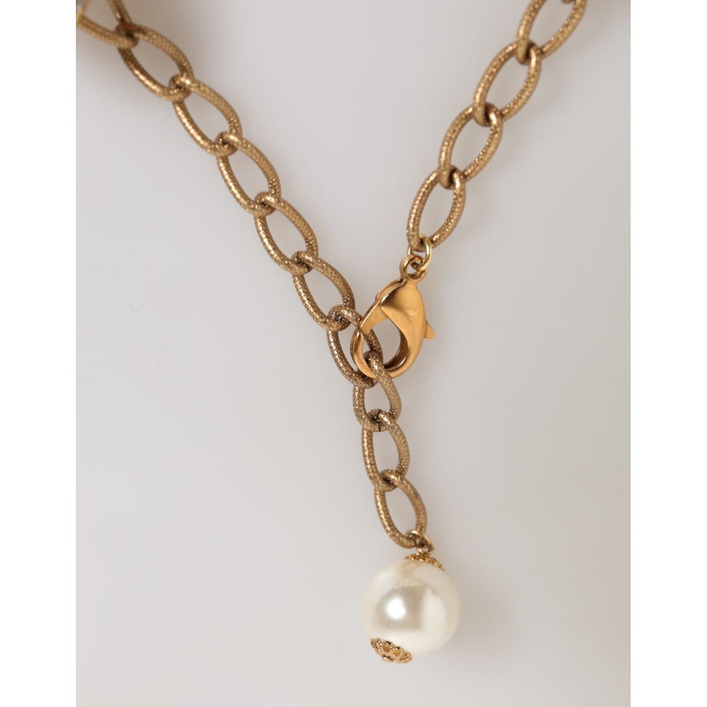 Dolce & Gabbana Gold Brass Faux Pearl Crystal Statement Luxury Jewelry Necklace with lobster clasp detail.