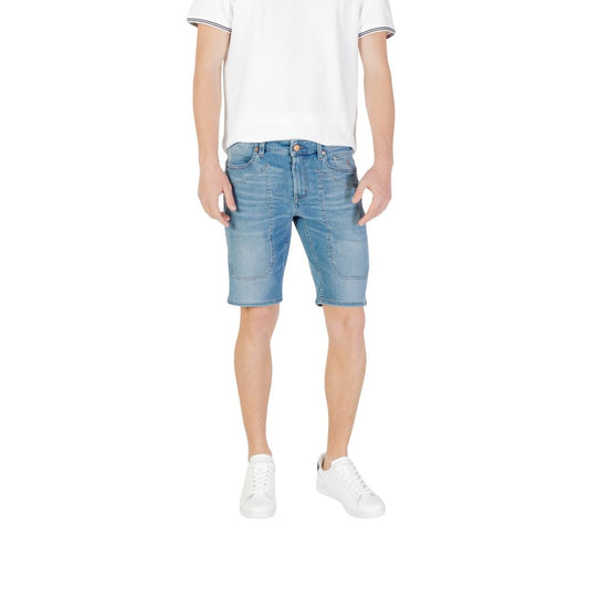 Model wearing Jeckerson Light Blue Cotton Bermuda Shorts for a casual summer look.