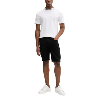 Model wearing Calvin Klein Jeans Black Cotton Bermuda Shorts paired with a white t-shirt and white sneakers, perfect for casual outings.