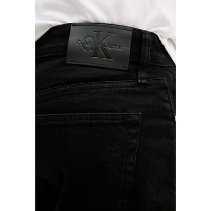 Close-up of Calvin Klein Jeans Black Cotton Bermuda Shorts featuring back pocket and logo patch detail.