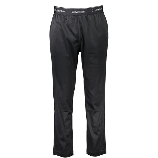 Calvin Klein Black Polyester Pant with elastic waist, lace detail, logo, and two pockets, ideal for sports and casual wear.