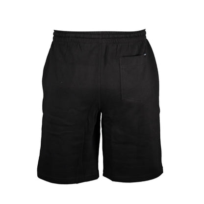 Vans Black Cotton Pant featuring short length, elastic waist with laces, fleece material, three pockets, print, and logo detail.