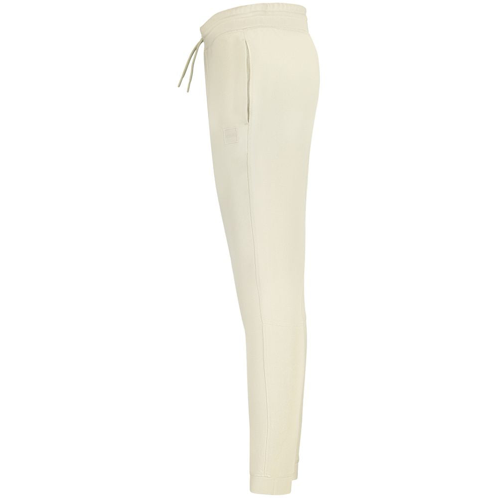 Hugo Boss Beige Cotton Pant, brushed sports trousers with elastic waist and laces, 3 pockets, ankle cuff, logo detailing.