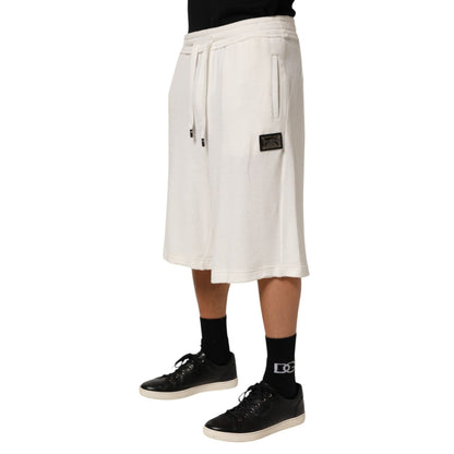 Dolce & Gabbana White Cotton Logo Plaque Men Bermuda Shorts showcasing designer casual elegance.