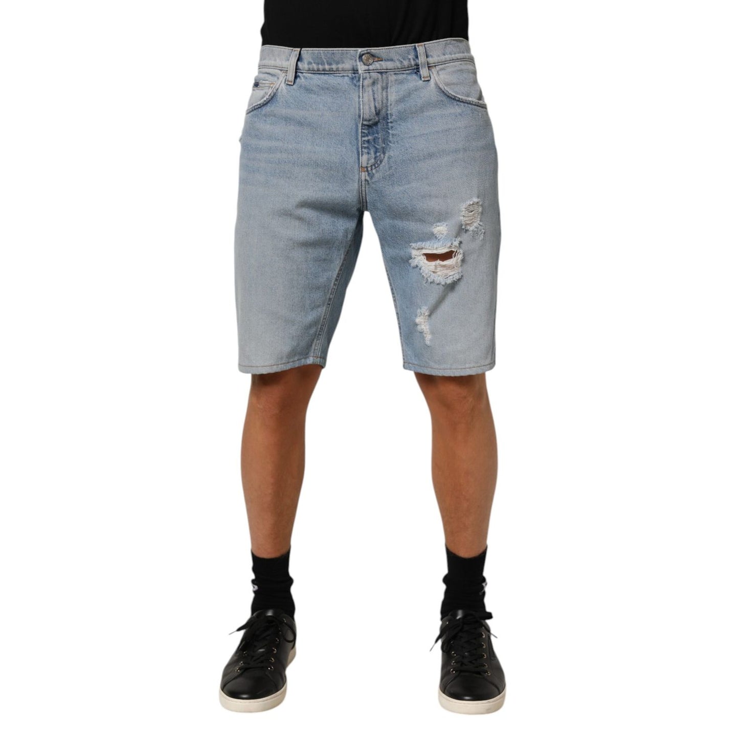 Dolce & Gabbana Blue Cotton Distressed Denim Bermuda Shorts showing front view with distressed details.