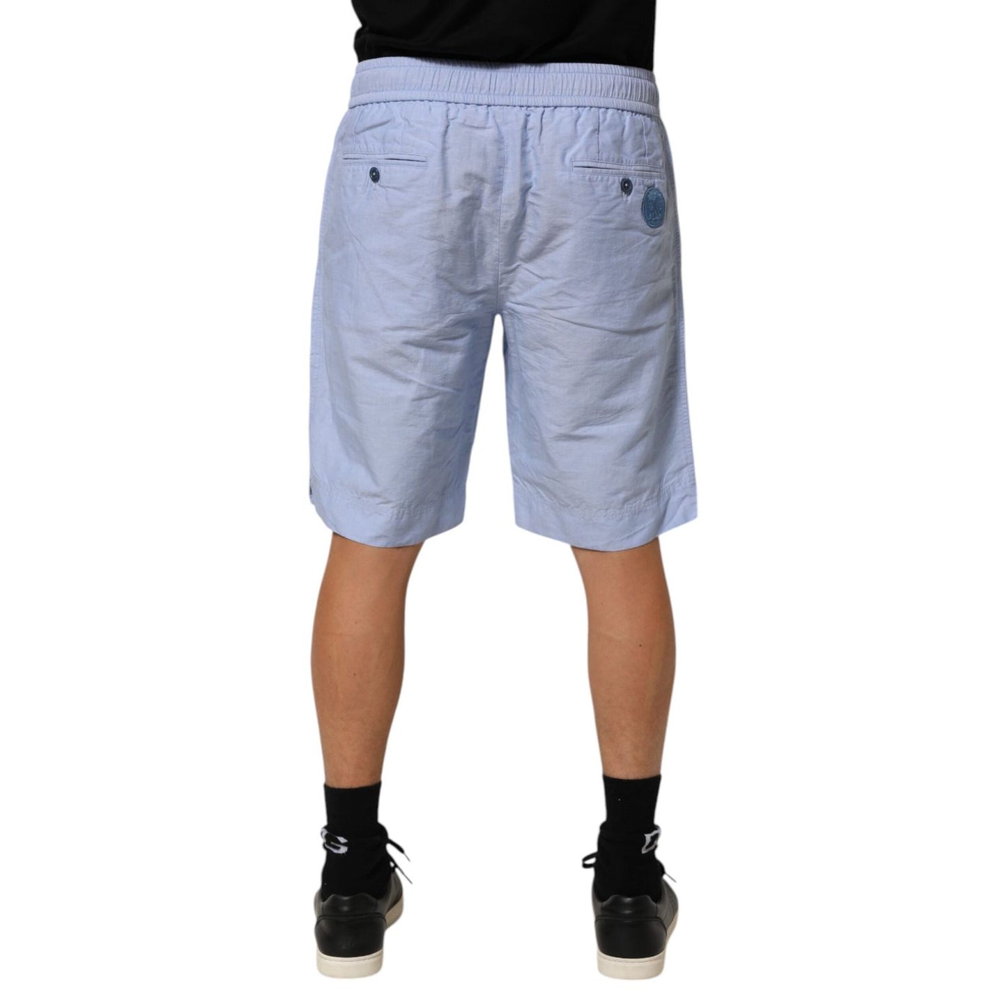 Back view of model wearing Dolce & Gabbana Light Blue Linen Mid Waist Men Bermuda Shorts.