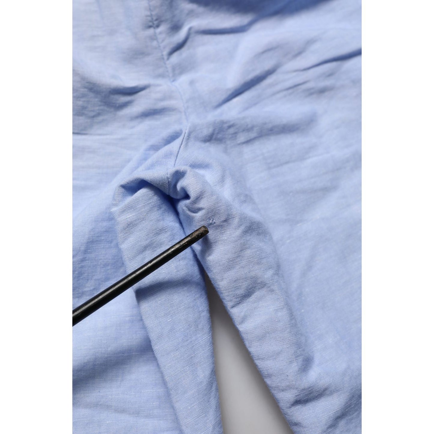 Close-up of Dolce & Gabbana Light Blue Linen Mid Waist Men Bermuda Shorts fabric detail