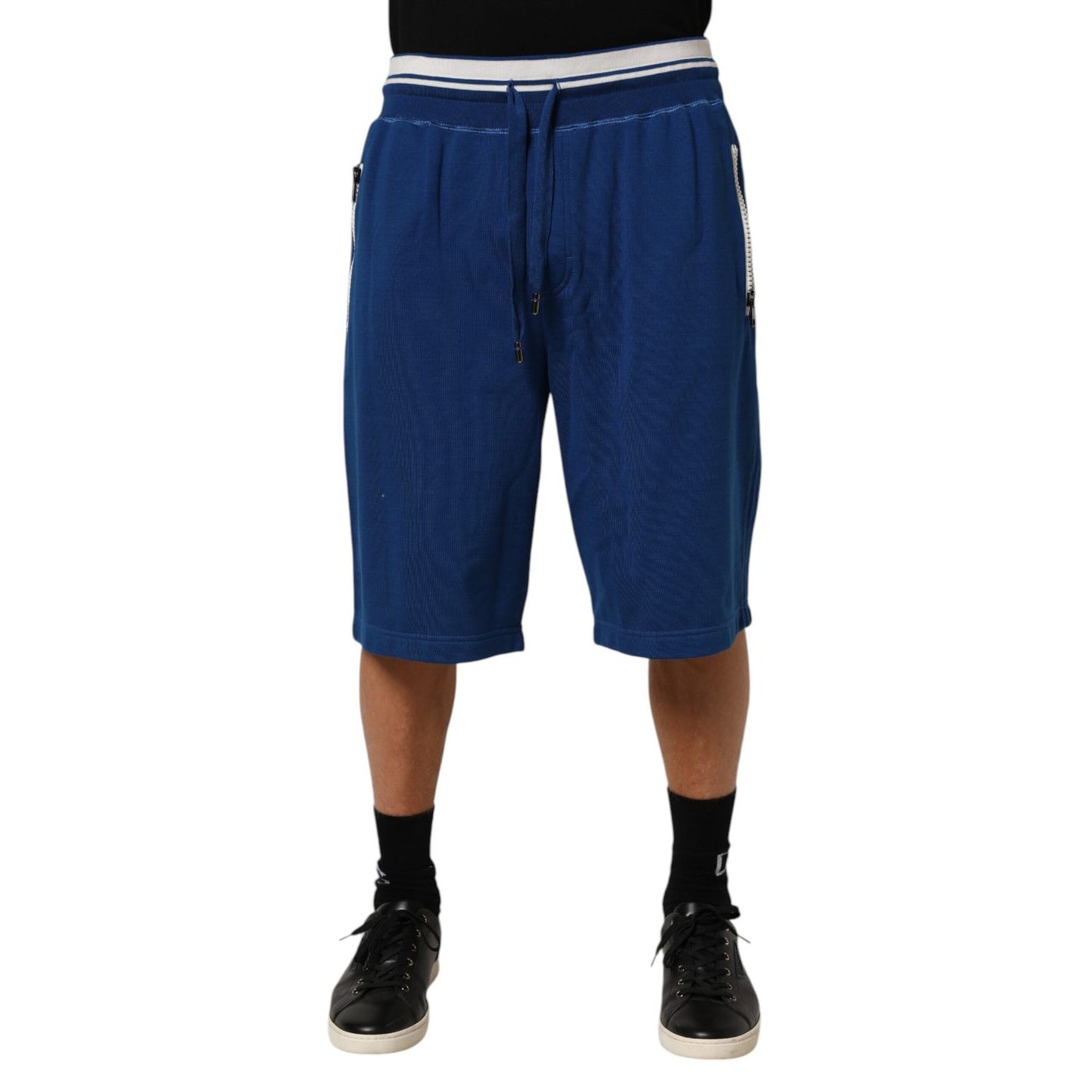 Dolce & Gabbana Blue Cotton Blend Bermuda Sweatpants Shorts with elastic waistband and drawstring for casual comfort and style.