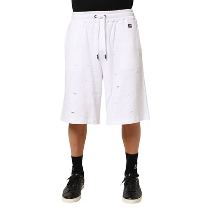Dolce & Gabbana White Cotton Ripped Bermuda Sweatpants Shorts with elastic waistband and drawstring for casual comfort and style.